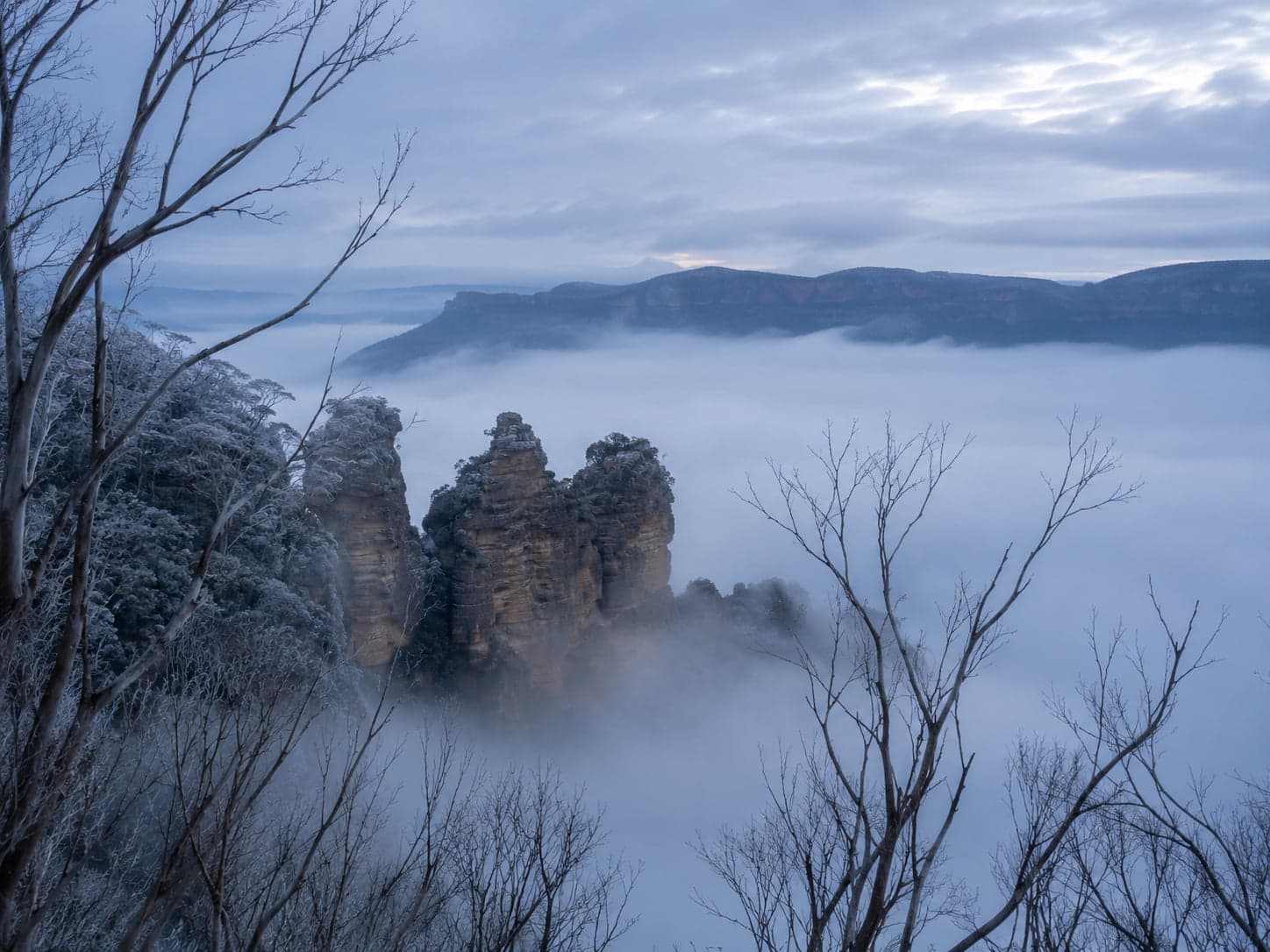 Misty winter morning at Echo Point Katoomba — the Three Sisters emerging from thick valley fog